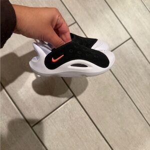 Nike Kids Black & White Slip-On Sneakers with Orange Swoosh